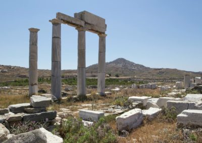 Explore the ancient ruins and historical architecture on the island of Delos in Greece.
